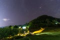 night landscape, village house under the stars at night Royalty Free Stock Photo