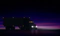 Night large classic big rig semi truck with headlights, dry van semi riding in dark on night road on starry sky background