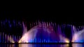 Night laser fountain show, on the Roshen embankment, the Ukrainian city of Vinnitsa.Musical fountain with laser