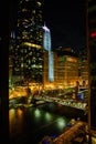 Night life on Chicago ship canals with bridge and skyscrapers Royalty Free Stock Photo