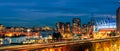 Night life of a huge seaside city with modern shining multicolored neon lights skyscrapers, top view Royalty Free Stock Photo