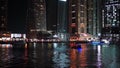 Night light street view on boats in Dubai Marina.