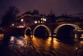 Night lighting reflections in Amsterdam channels from moving cruise boat. Blurred abstract photo as background. Royalty Free Stock Photo