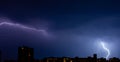 night lightning bolts over the city, storm scenery Royalty Free Stock Photo