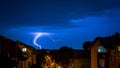 Night lightning hits the ground in the middle of the town