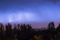 Night lightning storm over city in blue dramatic lighting Royalty Free Stock Photo