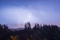 Night lightning storm over city in blue dramatic lighting Royalty Free Stock Photo