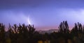 Night lightning storm over city in blue dramatic lighting Royalty Free Stock Photo