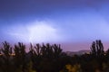 Night lightning storm over city in blue dramatic lighting Royalty Free Stock Photo