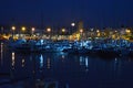 Picturesque Mediterranean port before dawn, moon sinking Royalty Free Stock Photo