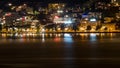 Night lights of a city on the lake. Royalty Free Stock Photo