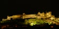 Night lights on the ramparts and castle towers of medieval Carcassonne Royalty Free Stock Photo