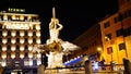 Night long exposition of the triton of the homonymous fountain and the Bernini hotel in Rome