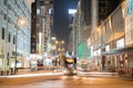 Night long exposure of passing vehicles on busy city street. Royalty Free Stock Photo