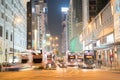 Night long exposure of passing vehicles on busy city street. Royalty Free Stock Photo