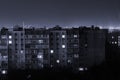 Night long exposure photo 9 and 10 floors high-rise buildings in black and white colours. Big city life is here Royalty Free Stock Photo