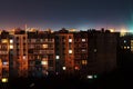 Night long exposure photo 9 and 10 floors high-rise buildings in orange colours. Big city life is here Royalty Free Stock Photo
