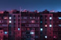 Night long exposure photo 9 and 10 floors high-rise buildings in red and blue colours. Big city life is here Royalty Free Stock Photo