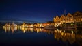 A night long exposure photography of Bergen at harbor with beautiful water reflection Royalty Free Stock Photo