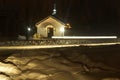 . night. a lot of snow. Country Church as a lighthouse at sunset. there dvezhenie car gleam