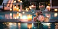 night Luxury resort poool glasses of wine and candles with tropic roses flowers spa relaxing background Royalty Free Stock Photo