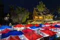 Night market and Haw Pha Bang temple in Luang Prabang Royalty Free Stock Photo