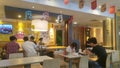 Shenzhen, China: at McDonald`s restaurants, people eat or rest at night.