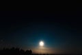 Night moon sky, full moon, Moon over the lake. Night landscape. Reflection of the rays from the moon in the water Royalty Free Stock Photo