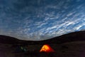 Night mountain landscape with illuminated tent Royalty Free Stock Photo