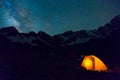 Night mountain landscape with illuminated tent Royalty Free Stock Photo
