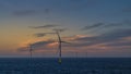 Night on the offshore wind park. Royalty Free Stock Photo