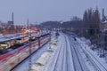 Night top view over platform railway station, railway track covered by snow in winter. Royalty Free Stock Photo