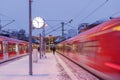 Night outdoor view on platform railway station in winter in Germany. Royalty Free Stock Photo