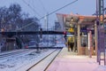 Night outdoor view on platform railway station in winter in Germany. Royalty Free Stock Photo