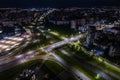 Night over road junction, intersection road with cars with headlights on highway. night life in big city. looking down on traffic Royalty Free Stock Photo