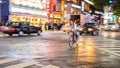 Night panning photography of unidentified man riding bicycle at Shibuya Square.The one of the wor