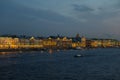 Night Panorama of Brightly Lit Buildings of the Embankment, Reflected in the Waters of the Neva River