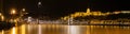 Night Panorama of Budapest full of Lights. Landmark Buda Castle by Danube river.