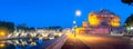 A night panorama of Castel Sant `angelo and a bridge over the Tiber River