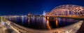 Night panorama of the illuminated Hohenzollern bridge over Rhine river. Beautiful cityscape of Cologne, Germany with cathedral Royalty Free Stock Photo