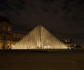 Night panorama of Louvre pyramid glass design architecture museum building construction in Paris France Europe