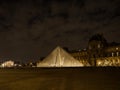 Night panorama of Louvre pyramid glass design architecture museum building construction in Paris France Europe
