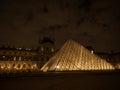 Night panorama of Louvre pyramid glass design architecture museum building construction in Paris France Europe