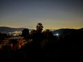 Night panorama of Naples in Italy with the outline of the Vesevius volcano visible Royalty Free Stock Photo