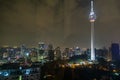 Night panorama of the television tower. KL Tower, Petronas Towers
