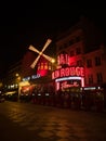 Night panorama view of Moulin Rouge concerts club entertainment cabaret Pigalle Montmartre Paris France Europe Royalty Free Stock Photo