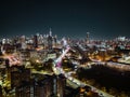 Night panoramic shot of modern metropolis with illuminated skyscrapers and busy highway. New York City, USA Royalty Free Stock Photo