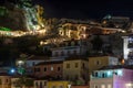 Night Panoramic View of Parga Town. Famous Tourist Resort with Traditional Illuminated Houses