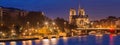 Night panoramic view of Cite island anf Notre-Dame cathedral, Paris. Royalty Free Stock Photo