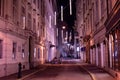 Night Paris. A narrow street illuminated by pink illumination Royalty Free Stock Photo
